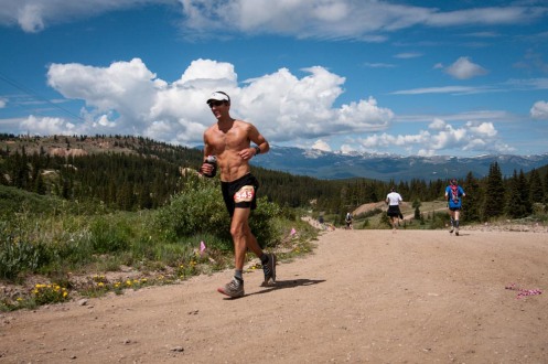 Forcing a smile on the climb out of the aid station at halfway.  Credit: Ryan Smith